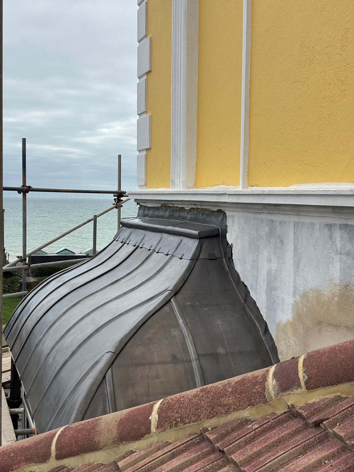 Curved lead dome dressed by hand on a Brighton seafront building