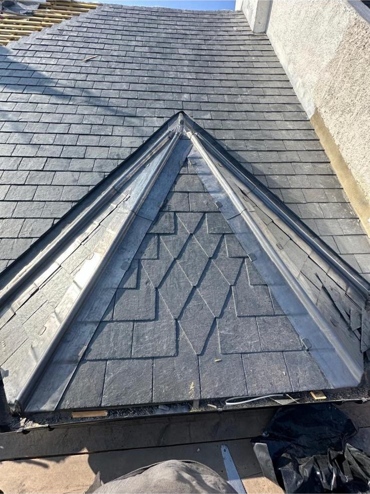 New slate roof with lead ridge detail