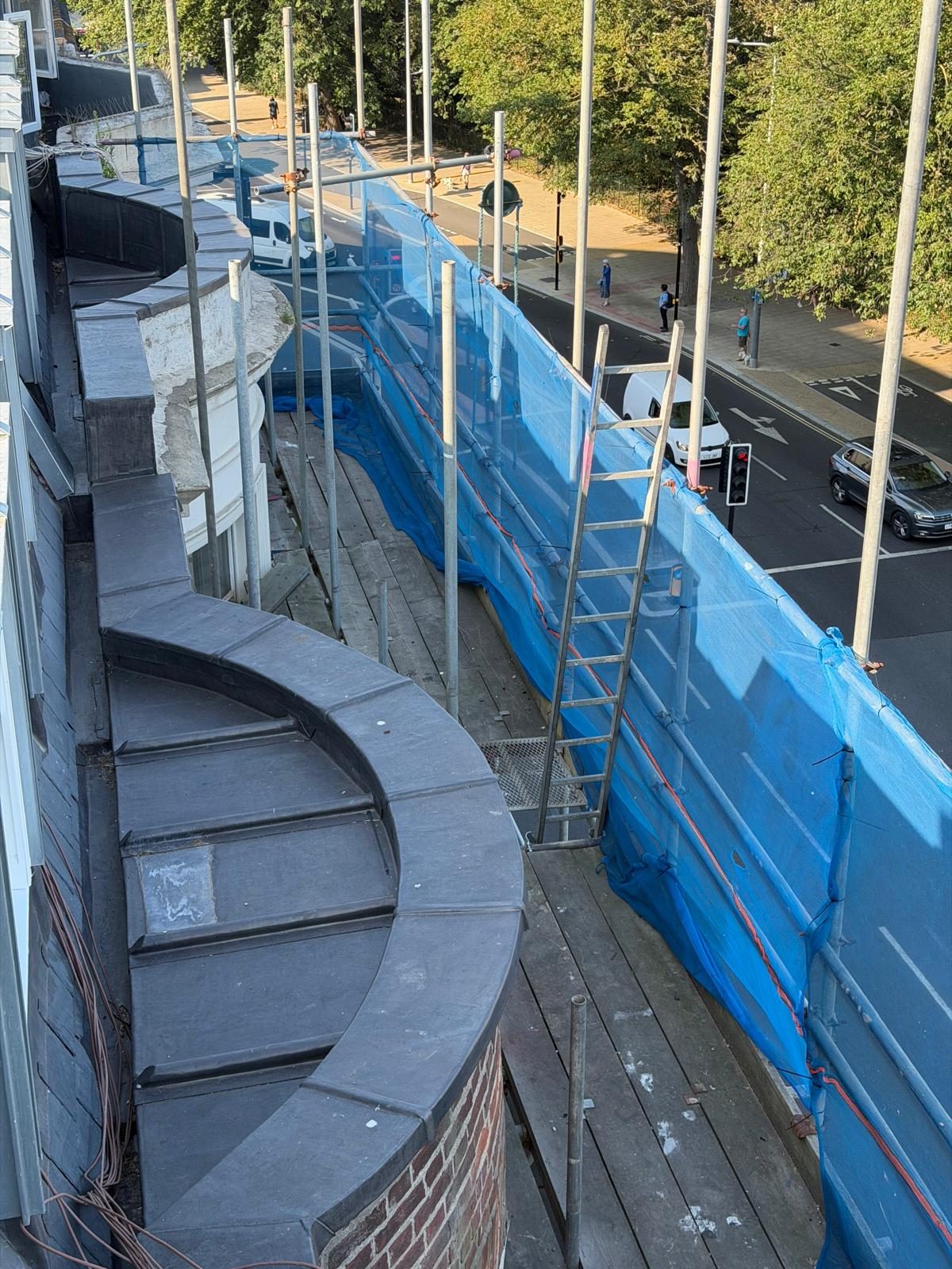 Curved lead parapet gutter run on a Brighton rooftop
