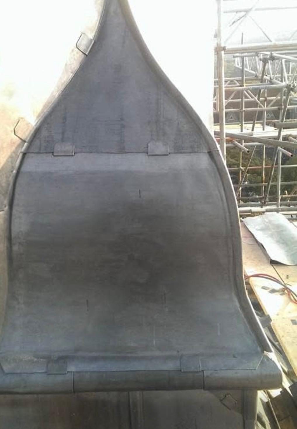 Ogee lead cheek formed by hand
