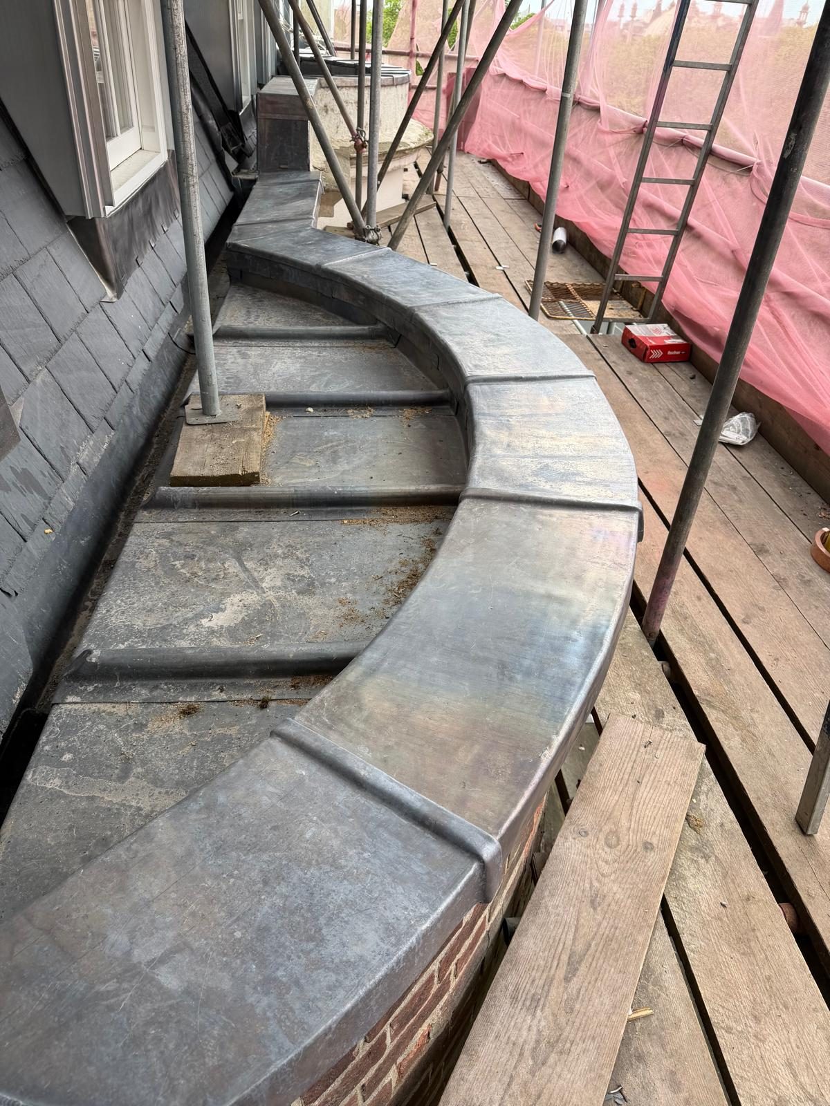 Curved lead parapet mid-install