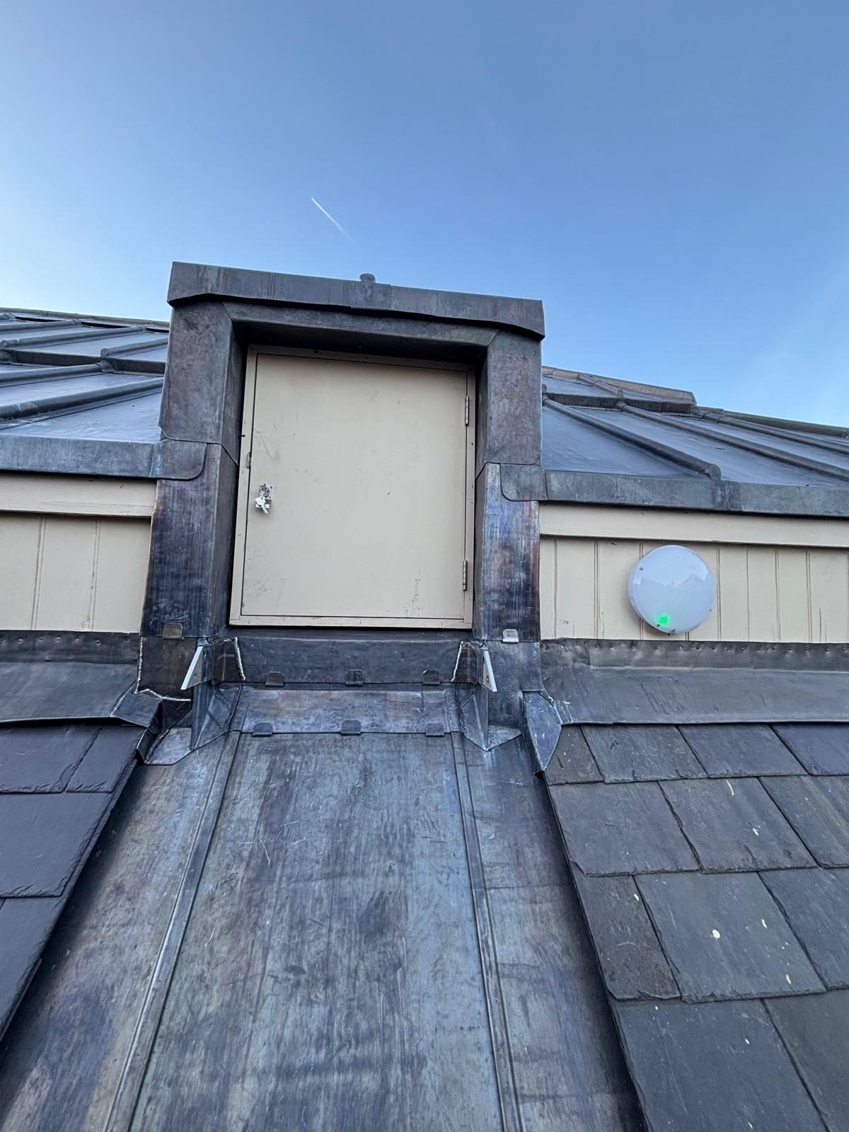 Slate roof with lead access dormer