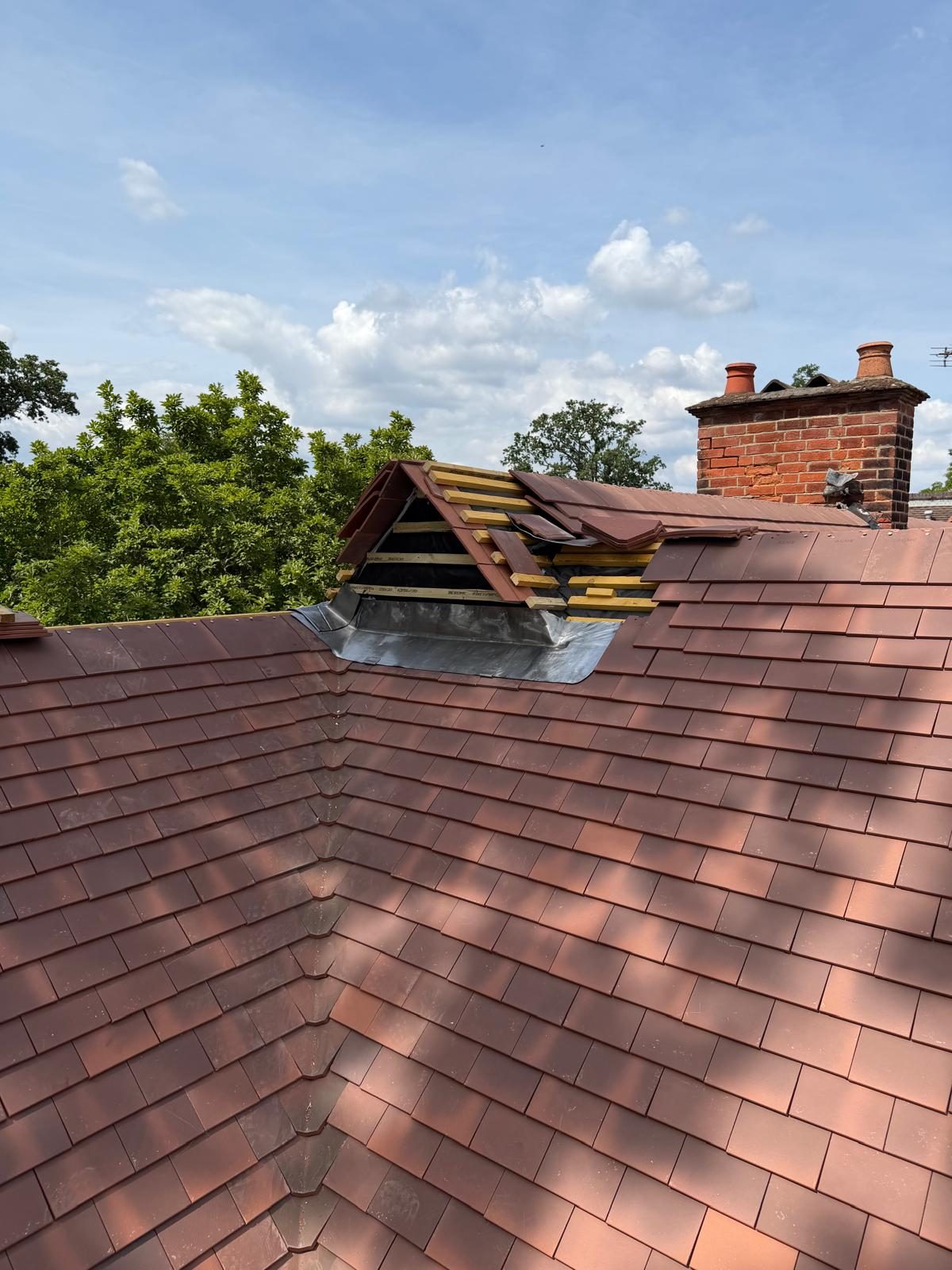 New tiled roof with chimney flashings